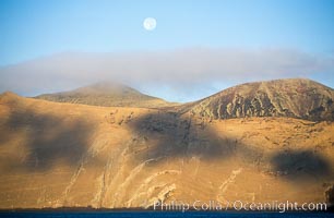 Arches on Isla Adentro and setting moon, daybreak, Guadalupe Island (Isla Guadalupe)