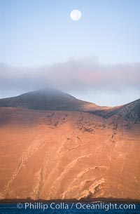 Arches on Isla Adentro and setting moon, daybreak, Guadalupe Island (Isla Guadalupe)