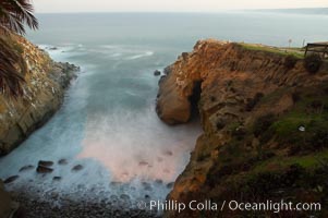 La Jolla Cave and rocky cove, waves blur at sunrise