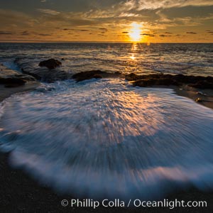 La Jolla coast sunset, waves wash over sandstone reef, clouds and sky