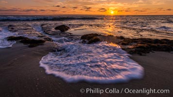 La Jolla coast sunset, waves wash over sandstone reef, clouds and sky