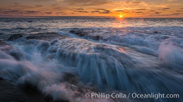 La Jolla coast sunset, waves wash over sandstone reef, clouds and sky
