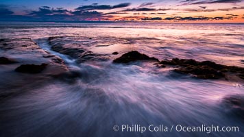 La Jolla coast sunset, waves wash over sandstone reef, clouds and sky