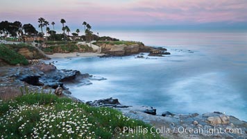 La Jolla Cove and earth shadow at dawn.  Just before sunrise the shadow of the Earth can seen as the darker sky below the pink sunrise