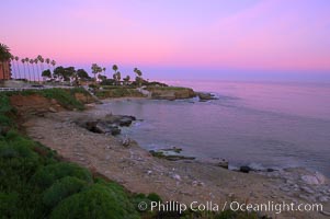 La Jolla Cove meets the dawn with pink skies and a flat ocean