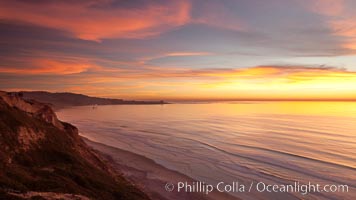 Sunset falls upon Torrey Pines State Reserve, viewed from the Torrey Pines glider port.  La Jolla, Scripps Institution of Oceanography and Scripps Pier are seen in the distance