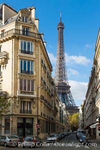 La Tour Eiffel. The Eiffel Tower is an iron lattice tower located on the Champ de Mars in Paris, named after the engineer Gustave Eiffel, who designed the tower in 1889 as the entrance arch to the 1889 World's Fair. The Eiffel tower is the tallest structure in Paris and the most-visited paid monument in the world