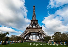 La Tour Eiffel. The Eiffel Tower is an iron lattice tower located on the Champ de Mars in Paris, named after the engineer Gustave Eiffel, who designed the tower in 1889 as the entrance arch to the 1889 World's Fair. The Eiffel tower is the tallest structure in Paris and the most-visited paid monument in the world