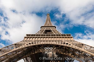 La Tour Eiffel. The Eiffel Tower is an iron lattice tower located on the Champ de Mars in Paris, named after the engineer Gustave Eiffel, who designed the tower in 1889 as the entrance arch to the 1889 World's Fair. The Eiffel tower is the tallest structure in Paris and the most-visited paid monument in the world