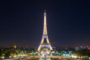 La Tour Eiffel. The Eiffel Tower is an iron lattice tower located on the Champ de Mars in Paris, named after the engineer Gustave Eiffel, who designed the tower in 1889 as the entrance arch to the 1889 World's Fair. The Eiffel tower is the tallest structure in Paris and the most-visited paid monument in the world