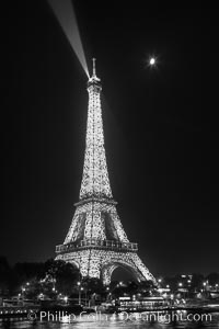 La Tour Eiffel. The Eiffel Tower is an iron lattice tower located on the Champ de Mars in Paris, named after the engineer Gustave Eiffel, who designed the tower in 1889 as the entrance arch to the 1889 World's Fair. The Eiffel tower is the tallest structure in Paris and the most-visited paid monument in the world