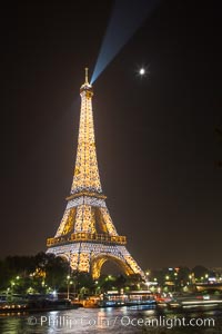 La Tour Eiffel. The Eiffel Tower is an iron lattice tower located on the Champ de Mars in Paris, named after the engineer Gustave Eiffel, who designed the tower in 1889 as the entrance arch to the 1889 World's Fair. The Eiffel tower is the tallest structure in Paris and the most-visited paid monument in the world