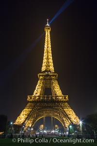 La Tour Eiffel. The Eiffel Tower is an iron lattice tower located on the Champ de Mars in Paris, named after the engineer Gustave Eiffel, who designed the tower in 1889 as the entrance arch to the 1889 World's Fair. The Eiffel tower is the tallest structure in Paris and the most-visited paid monument in the world