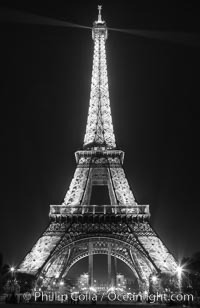 La Tour Eiffel. The Eiffel Tower is an iron lattice tower located on the Champ de Mars in Paris, named after the engineer Gustave Eiffel, who designed the tower in 1889 as the entrance arch to the 1889 World's Fair. The Eiffel tower is the tallest structure in Paris and the most-visited paid monument in the world