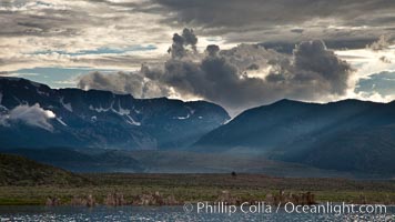 Lee Vining Canyon and the Sierra Nevada mountain range, with storm clouds and sun beams, viewed from Mono Lake