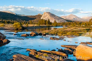 The Tuolumne River flows serenely through Tuolumne Meadows in the High Sierra. Lembert Dome is seen in the background, Yosemite National Park, California