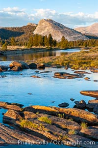 The Tuolumne River flows serenely through Tuolumne Meadows in the High Sierra. Lembert Dome is seen in the background, Yosemite National Park, California