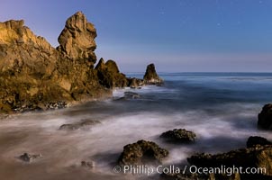 Little Corona Beach, at night under a full moon, waves lit by moonlight