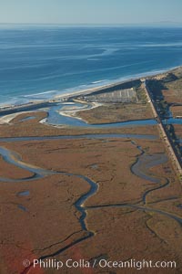 Los Penasquitos Marsh, seen from above along the coast south of Del Mar, where it exchanges fresh and salt water iwith the Pacific Ocean along Torrey Pines State Beach.