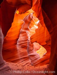 Slot canyons are formed when water and wind erode a cut through a (usually sandstone) mesa. Lower Antelope Canyon, Arizona.