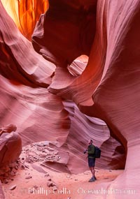 Hiking and photographing, Lower Antelope Canyon, Page, Arizona.