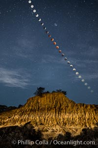 Lunar Eclipse Sequence Over Broken Hill, Torrey Pines State Reserve. While the moon lies in the full shadow of the earth (umbra) it receives only faint, red-tinged light refracted through the Earth's atmosphere. As the moon passes into the penumbra it receives increasing amounts of direct sunlight, eventually leaving the shadow of the Earth altogether. October 8, 2014, San Diego, California