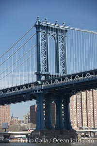 Manhattan Bridge viewed from the East River.  Lower Manhattan visible behind the Bridge, New York City