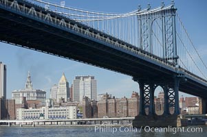 Manhattan Bridge viewed from the East River.  Lower Manhattan visible behind the Bridge, New York City