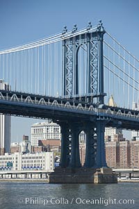 Manhattan Bridge viewed from the East River.  Lower Manhattan visible behind the Bridge, New York City