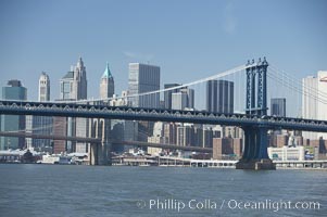 Manhattan Bridge viewed from the East River.  Lower Manhattan visible behind the Bridge, New York City