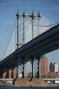 Manhattan Bridge viewed from the East River.  Lower Manhattan visible behind the Bridge, New York City