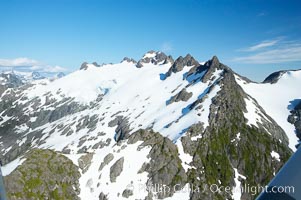 Mariner Mountain, viewed from the northwest, on the west coast of Vancouver Island, British Columbia, Canada, part of Strathcona Provincial Park, located 36 km (22 mi) north of Tofino.  It is 1,771 m (5,810 ft) high, snow covered year-round and home to several glaciers