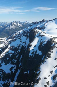 Mariner Mountain, viewed from the northeast, on the west coast of Vancouver Island, British Columbia, Canada, part of Strathcona Provincial Park, located 36 km (22 mi) north of Tofino.  It is 1,771 m (5,810 ft) high, snow covered year-round and home to several glaciers