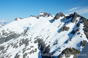 Mariner Mountain, viewed from the northwest, on the west coast of Vancouver Island, British Columbia, Canada, part of Strathcona Provincial Park, located 36 km (22 mi) north of Tofino.  It is 1,771 m (5,810 ft) high, snow covered year-round and home to several glaciers