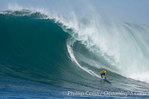 Grant Baker, champion, catches one of his many great waves of the day, this one in the first round.  Mavericks surf contest, February 7, 2006, Half Moon Bay, California