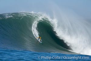 Grant Baker, 2006 Mavericks champion, visits from South Africa and catches one of his many great waves of the day, this one in the first round.  Mavericks surf contest, February 7, 2006, Half Moon Bay, California