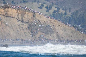 Mavericks surf contest crowd enjoys the sun and warm weather on the Pillar Point cliffs, February 7, 2006, Half Moon Bay, California