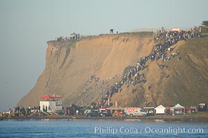 Mavericks surf contest crowd enjoys the sun and warm weather on the Pillar Point cliffs, February 7, 2006, Half Moon Bay, California