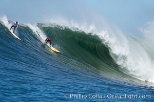 Shawn Rhodes (white) and Ryan Seelbach (red) in heat four of the 2006 Mavericks surf contest, February 7, 2006, Half Moon Bay, California