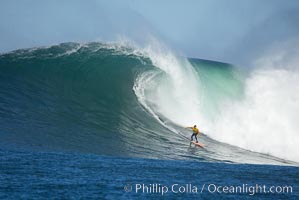 2006 Mavericks surf contest champion Grant Twiggy Baker of South Africa catches one of his many great waves of the day, this one in the first round.  Mavericks surf contest, February 7, 2006, Half Moon Bay, California