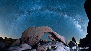 The Milky Way galaxy arcs above Arch Rock, panoramic photograph, spherical projection, Joshua Tree National Park, California