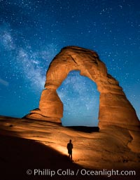 Milky Way arches over Delicate Arch, as stars cover the night sky. (Note: this image was created before a ban on light-painting in Arches National Park was put into effect.  Light-painting is no longer permitted in Arches National Park)