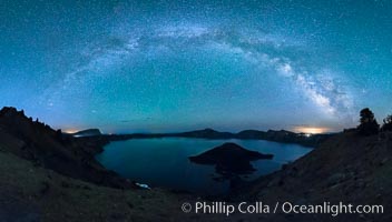 Milky Way and stars over Crater Lake at night. Panorama of Crater Lake and Wizard Island at night, Crater Lake National Park