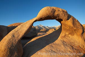 Mobius Arch in golden early morning light.  The natural stone arch is found in the scenic Alabama Hlls near Lone Pine, California, Alabama Hills Recreational Area