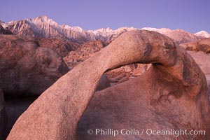 Mobius Arch, the Alabama Hills and the Sierra Nevada Range at sunrise, pink early morning light, Alabama Hills Recreational Area