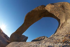 Mobius Arch in golden early morning light.  The natural stone arch is found in the scenic Alabama Hlls near Lone Pine, California, Alabama Hills Recreational Area