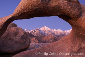 Mobius Arch at sunrise, framing snow dusted Lone Pine Peak and the Sierra Nevada Range in the background.  Also known as Galen's Arch, Mobius Arch is found in the Alabama Hills Recreational Area near Lone Pine. California, USA, natural history stock photograph, photo id 21736