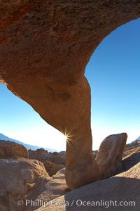 Mobius Arch in golden early morning light.  The natural stone arch is found in the scenic Alabama Hlls near Lone Pine, California, Alabama Hills Recreational Area