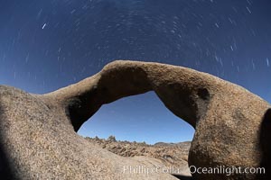 Mobius Arch in the Alabama Hills, seen here at night with swirling star trails formed in the sky above due to a long time exposure, Alabama Hills Recreational Area