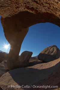 Mobius Arch in golden early morning light.  The natural stone arch is found in the scenic Alabama Hlls near Lone Pine, California, Alabama Hills Recreational Area